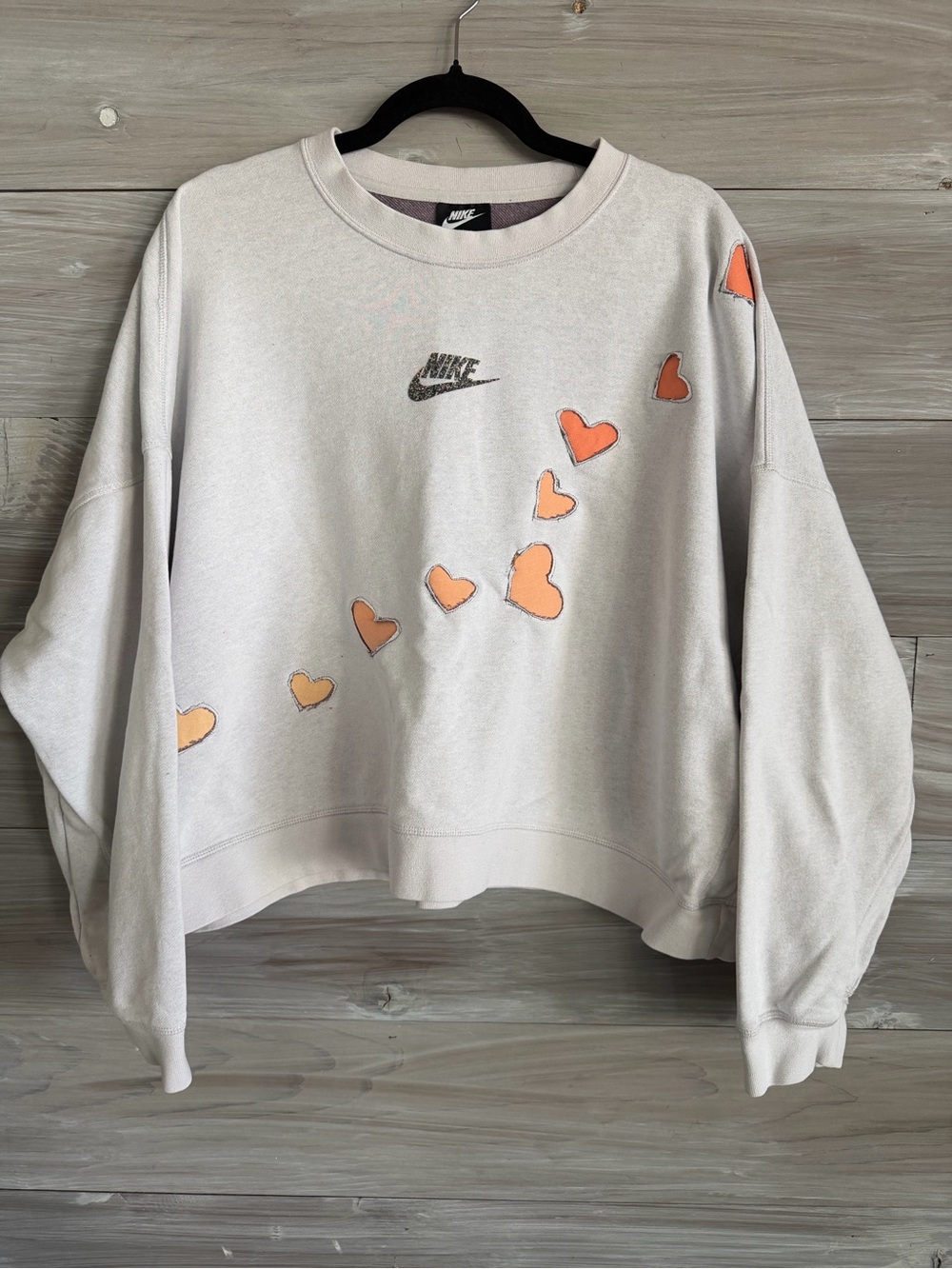 Nike Women’s cropped Crewneck Sweatshirt with Orange Heart Accents